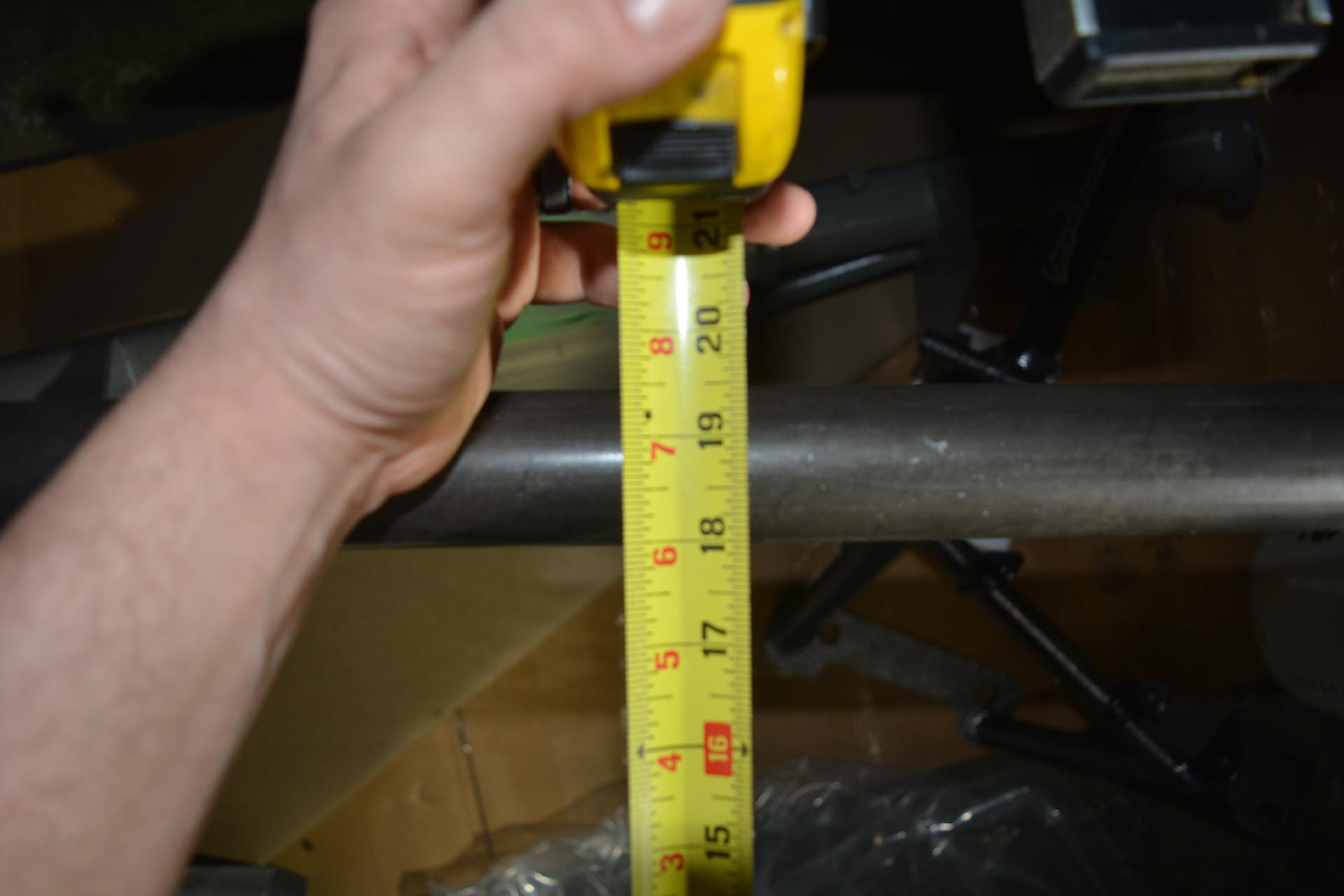 Measuring the space between the cage rear cross bar and coilover bar